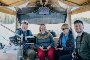 Skipper telling stories on Saimaa story cruise Ecoboat lake Saimaa Puumala Lakelandgte