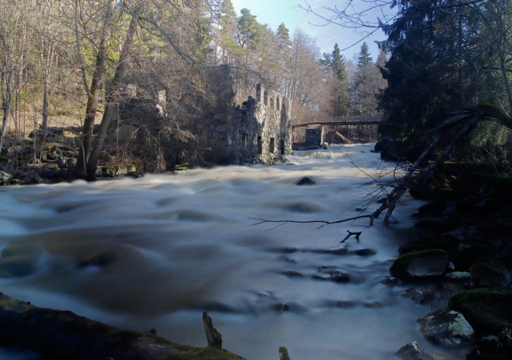 The rapid flows vigorously beside the mill ruins. It is summer